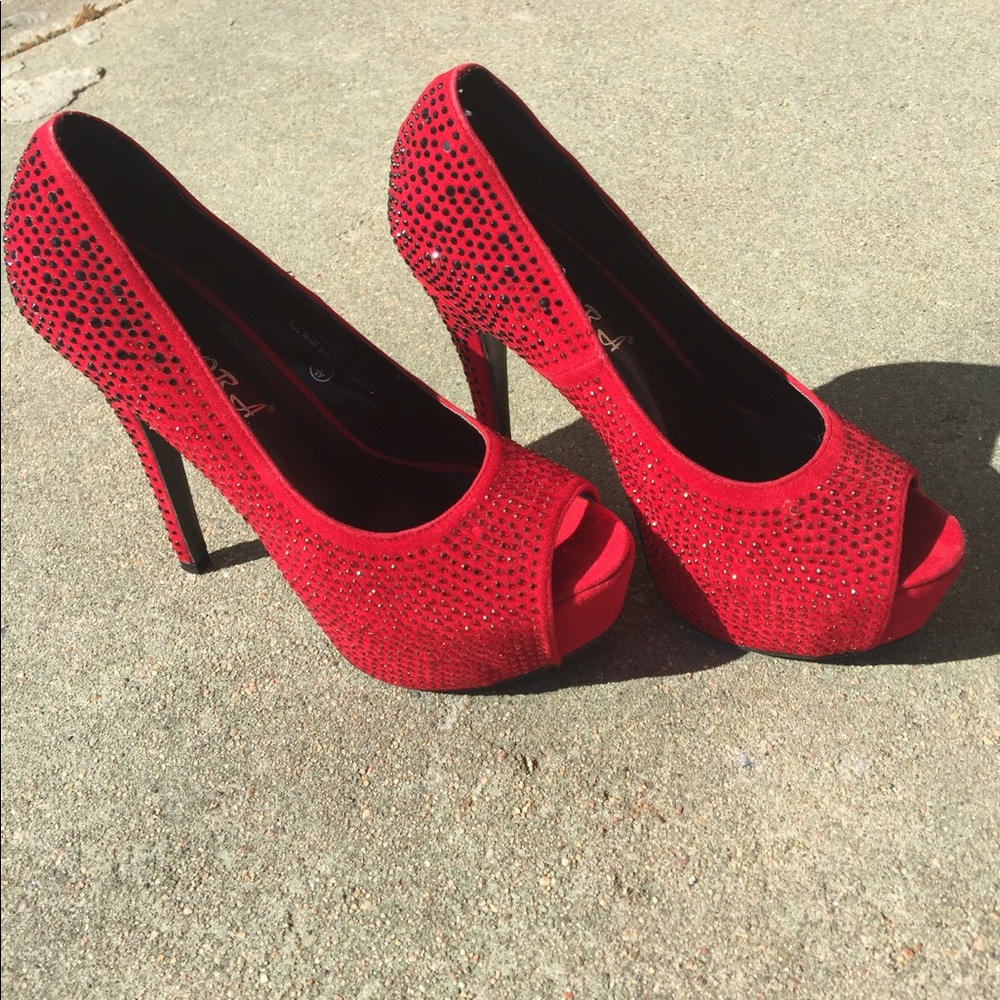 Red high heels embellished with crystals.